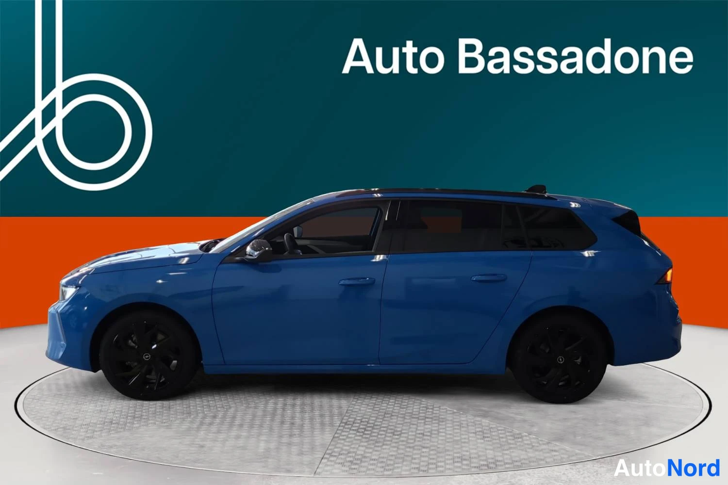 Blue Opel Astra sports tourer 2026, side, photo 4