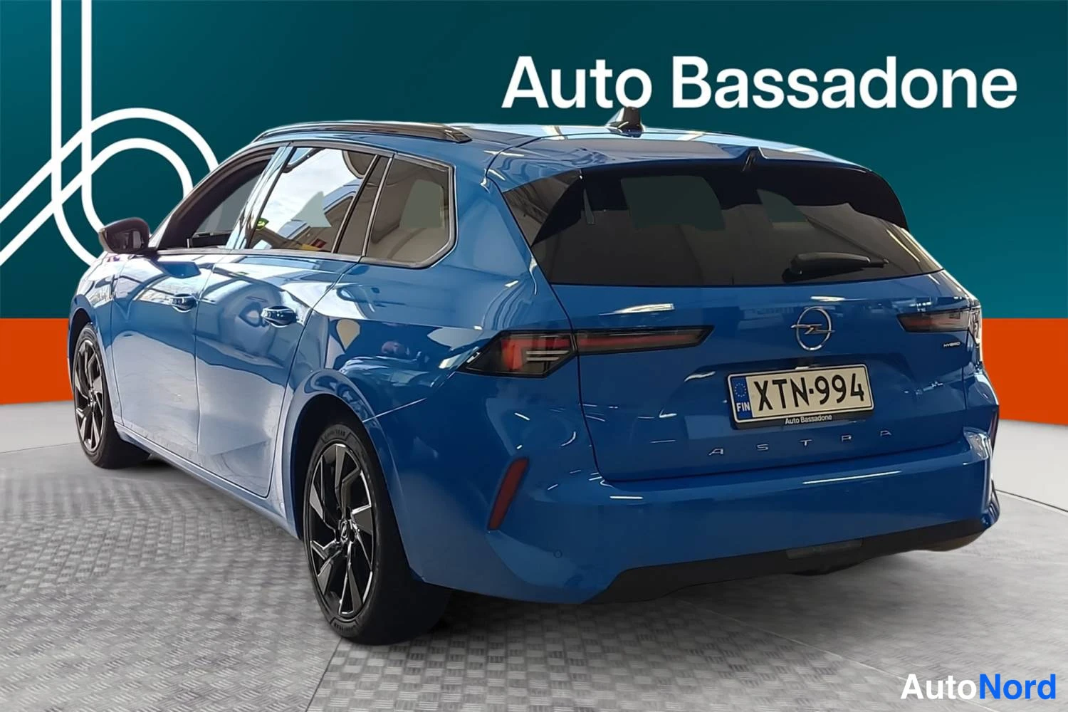 Blue Opel Astra sports tourer 2026, rear three-quarter, photo 6