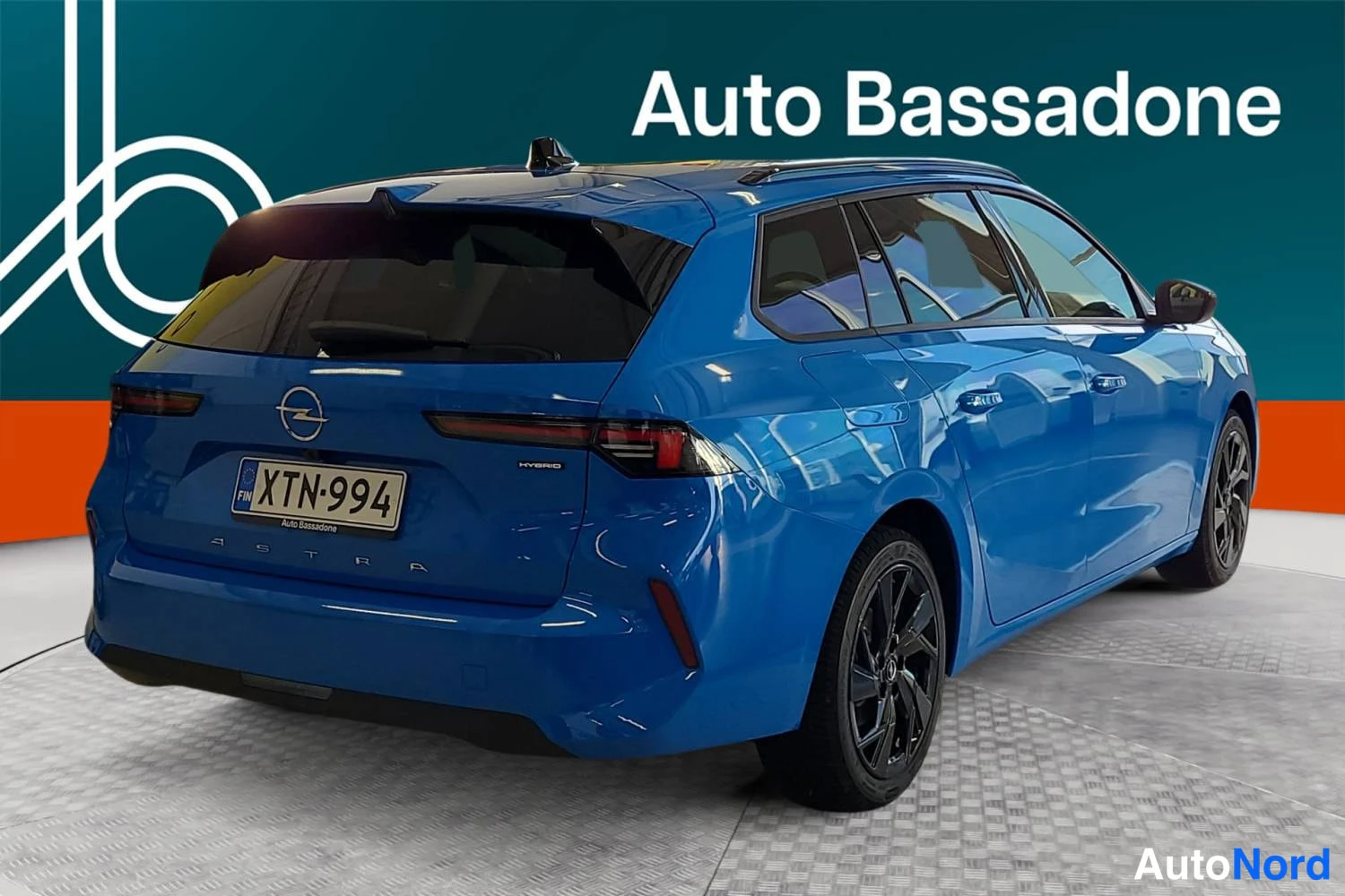 Blue Opel Astra sports tourer 2026, rear three-quarter, photo 7