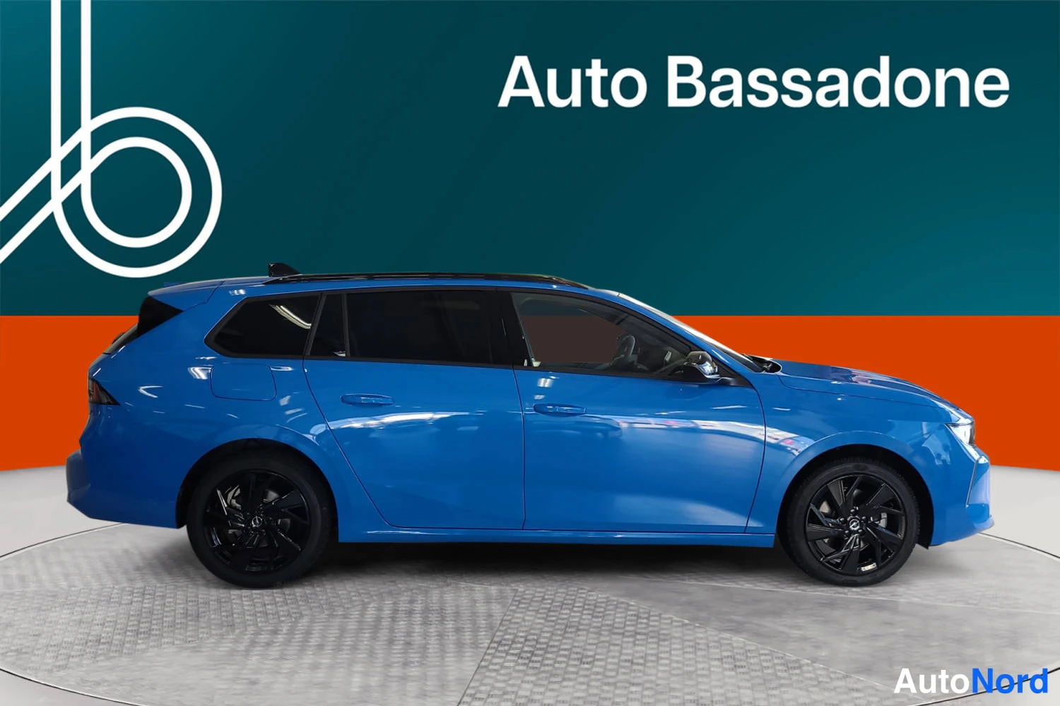 Blue Opel Astra sports tourer 2026, side, photo 5