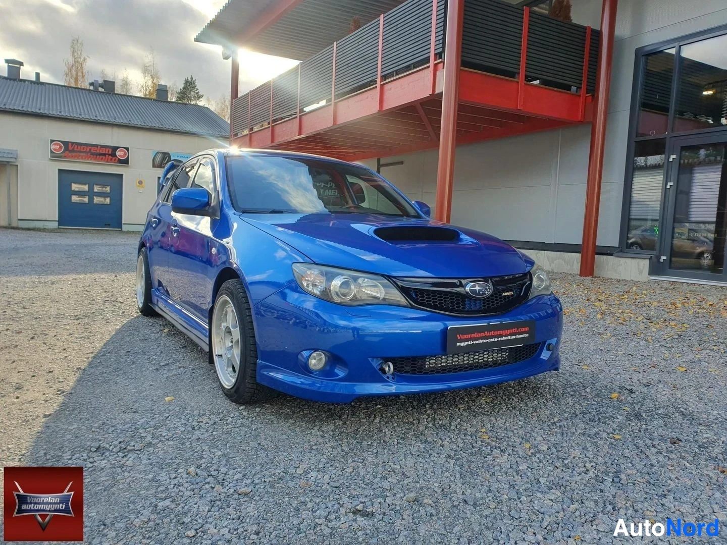 Sininen Subaru Impreza 2008, etuviisto, keula oikealle, kuva 2