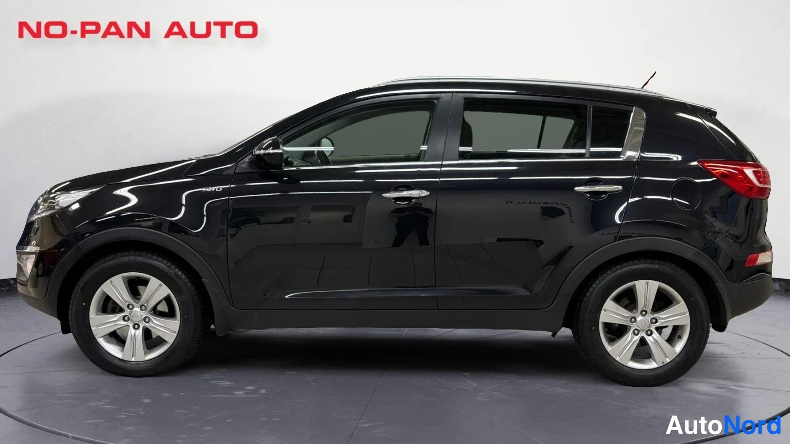Musta Kia Sportage 2013, sivulta, kuva 5