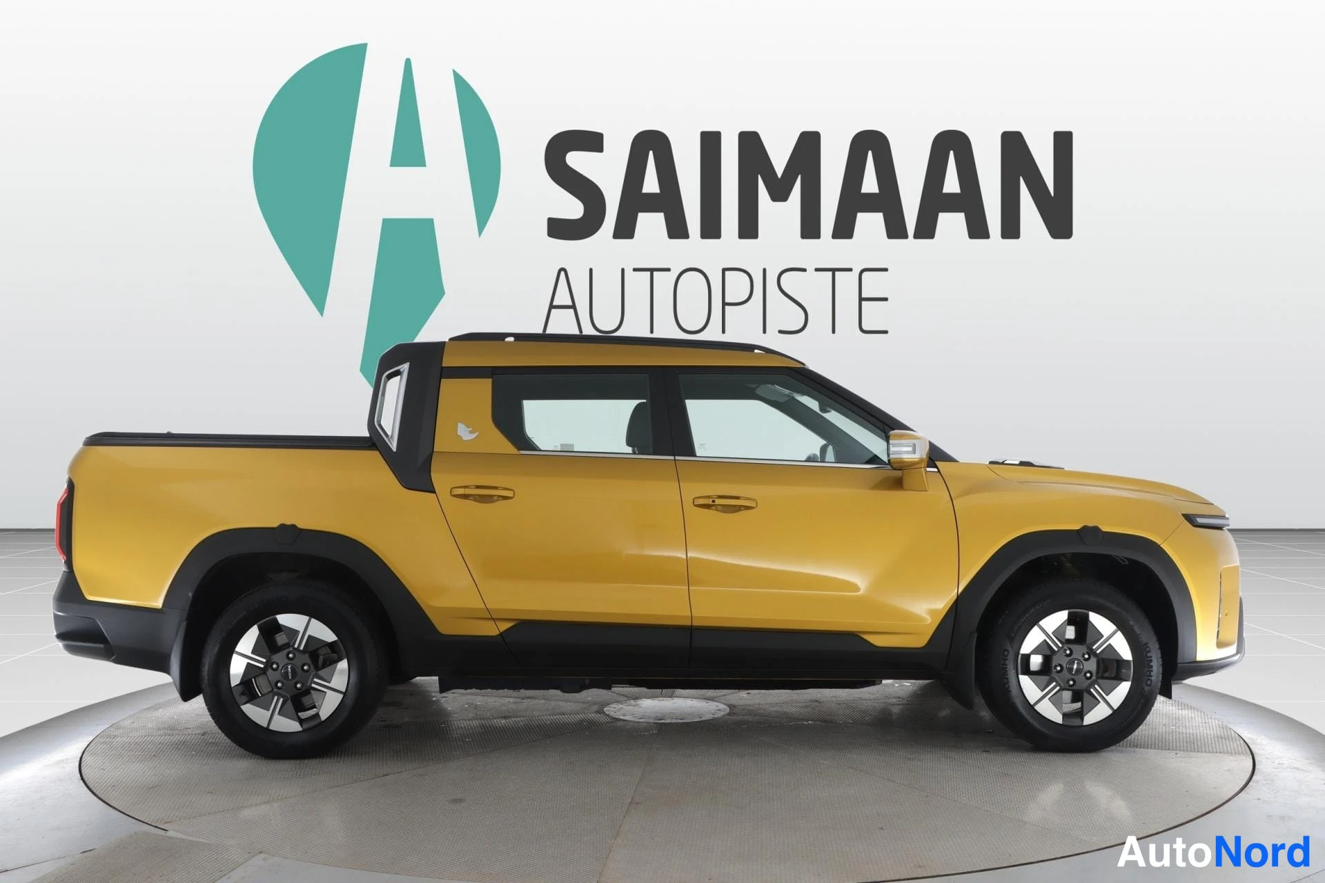 Keltainen KGM Musso EV 2025, sivulta, kuva 6