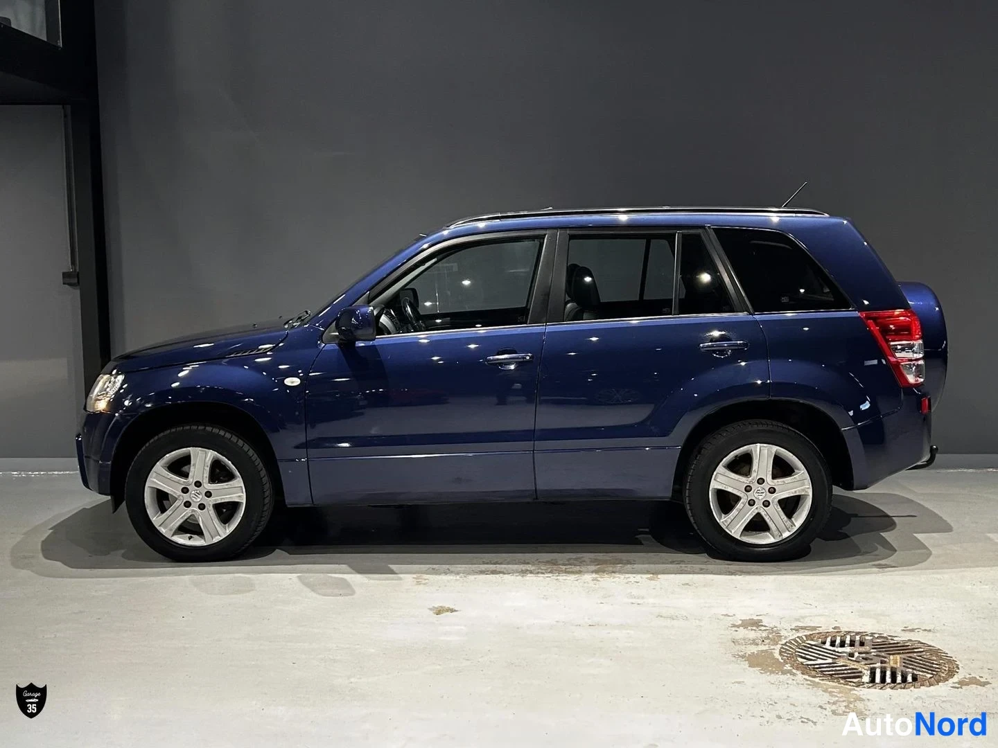 Sininen Suzuki Grand Vitara 2007, sivulta, kuva 5