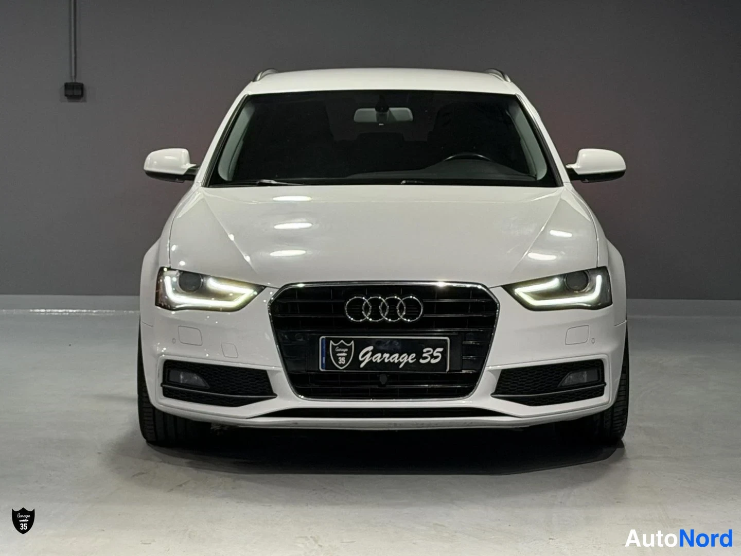 Valkoinen Audi A4 Avant 2014, edestä, kuva 6