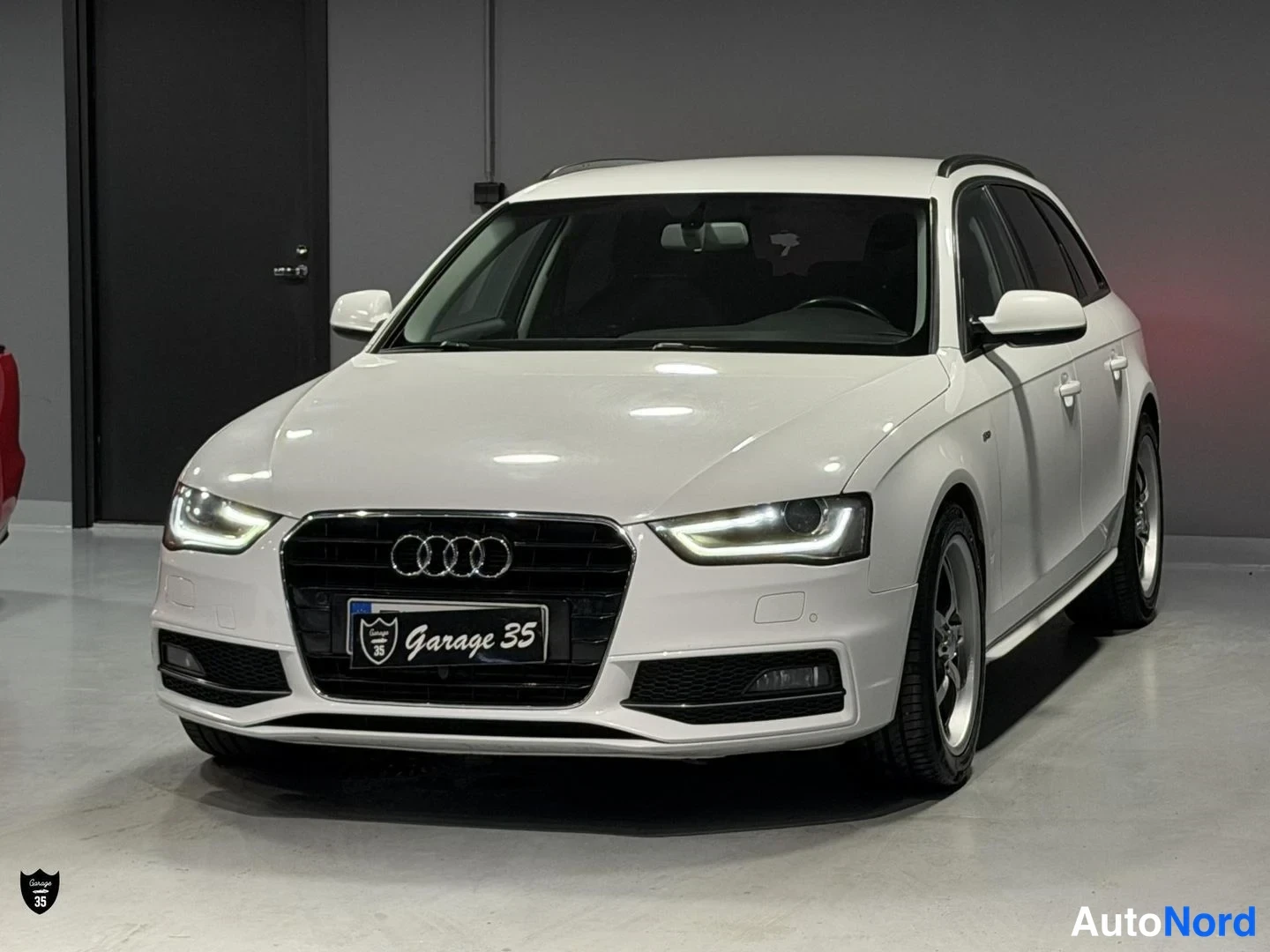 Valkoinen Audi A4 Avant 2014, etuviisto, keula vasemmalle, kuva 2