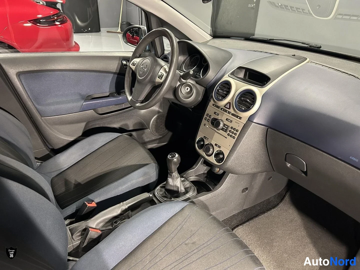 Sininen Opel Corsa 2007, ohjaamo, kuva 11