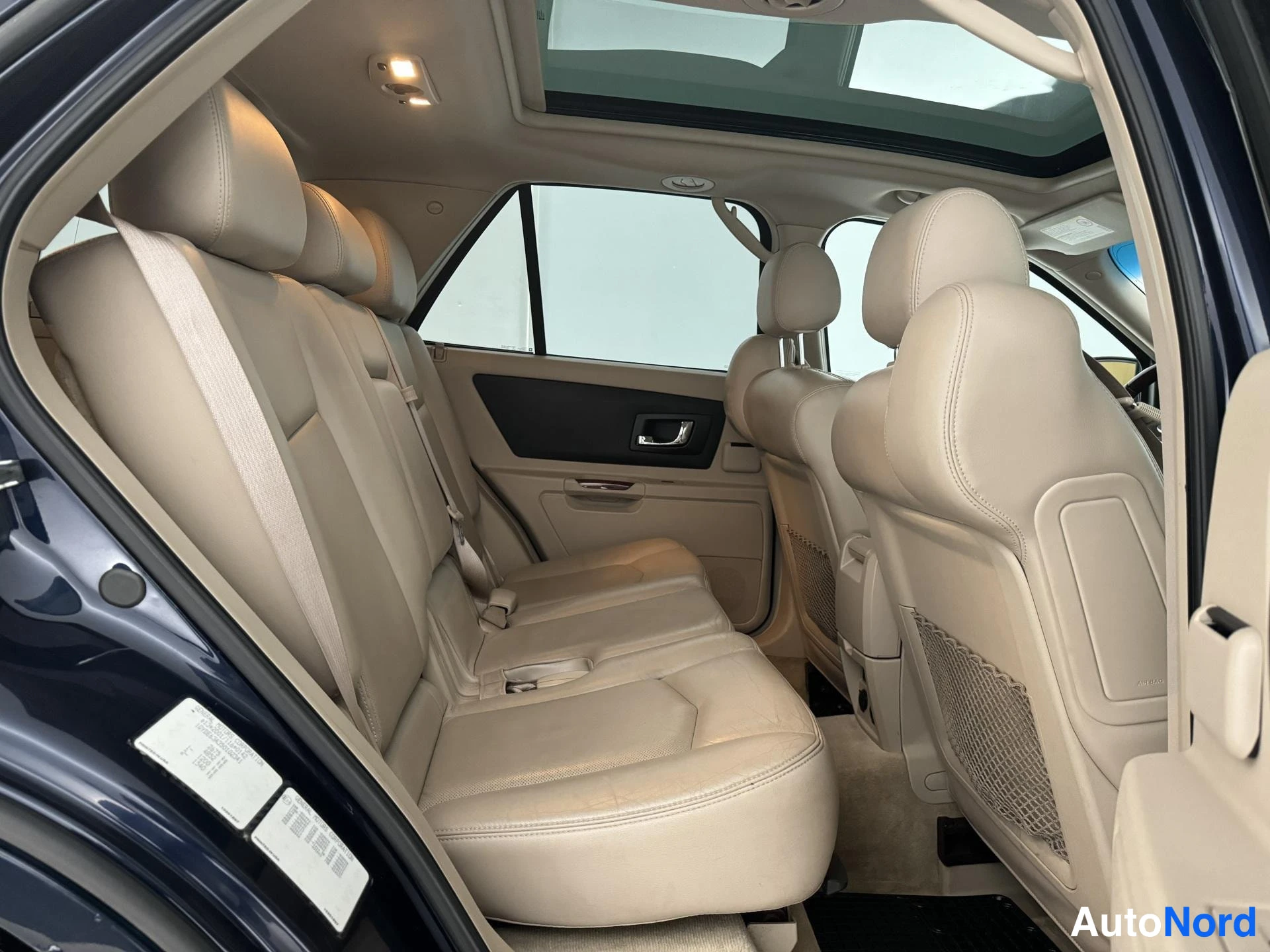 Sininen Cadillac SRX 2004, takaistuimet, kuva 17