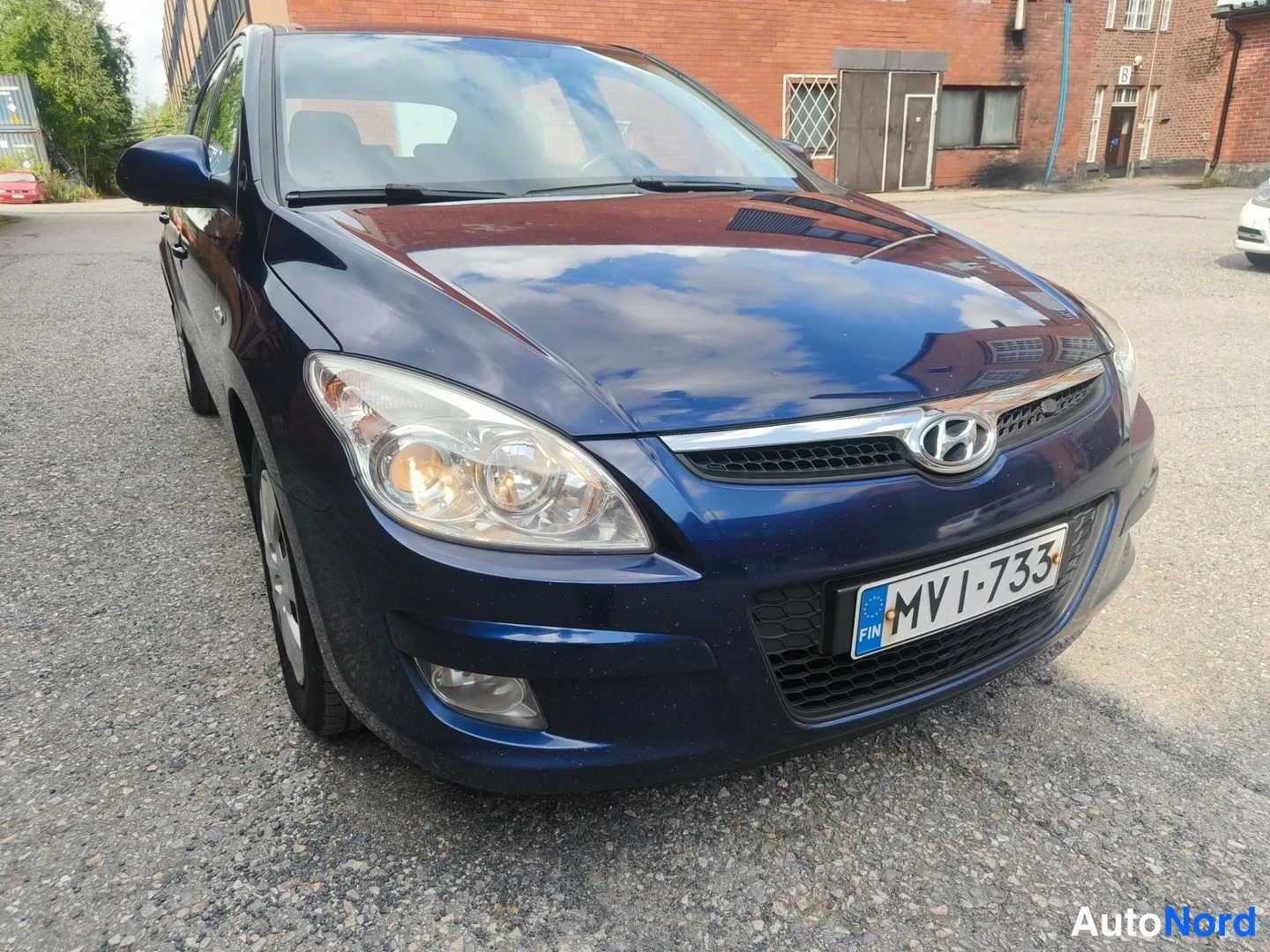 Sininen Hyundai i30 2008, etuviisto, keula oikealle, kuva 3