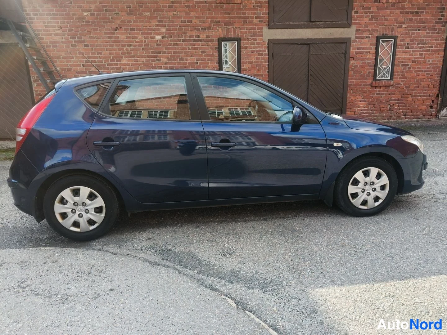 Sininen Hyundai i30 2008, etuviisto, keula oikealle, kuva 2