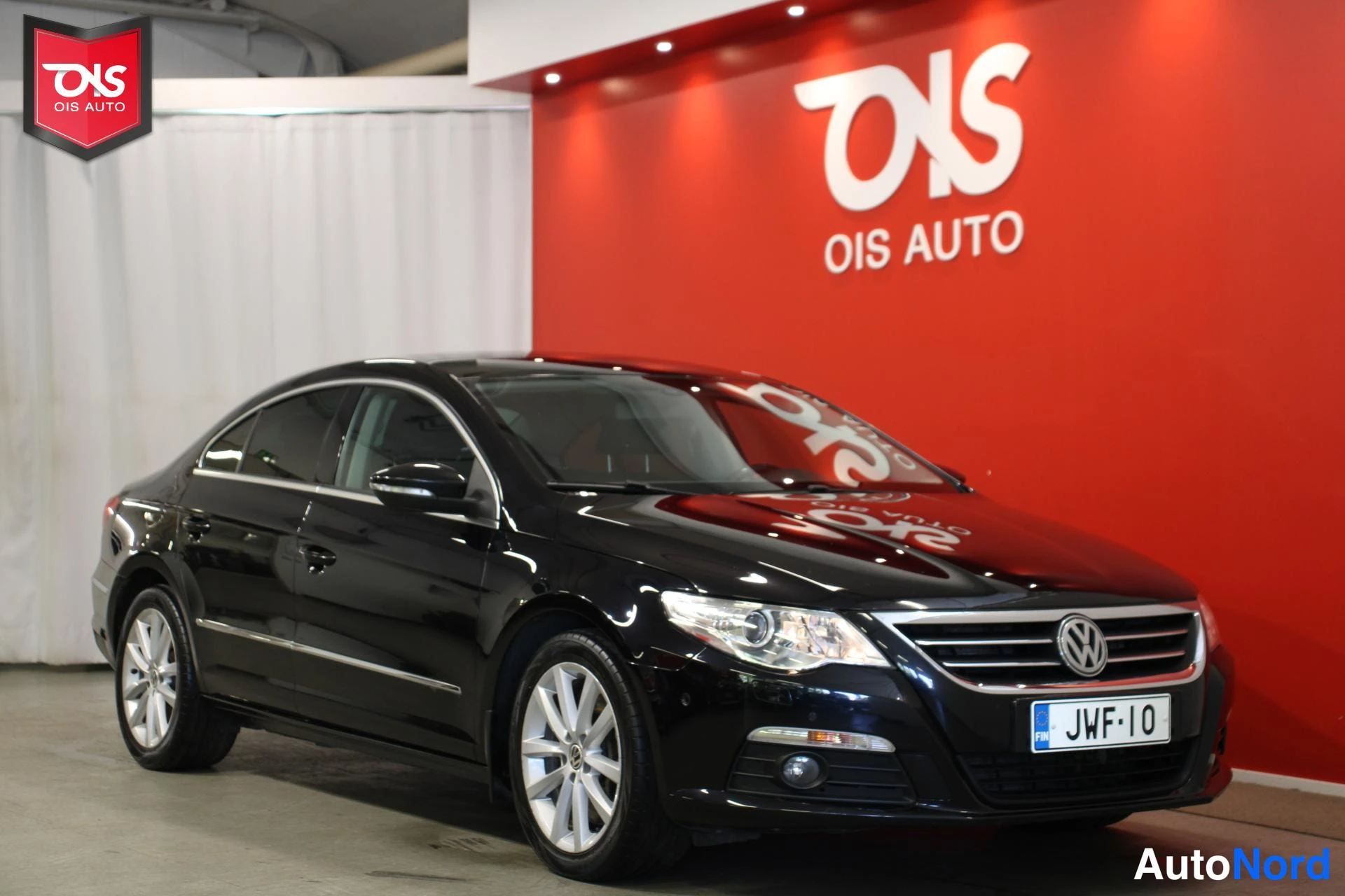 Musta Volkswagen Passat 2009, etuviisto, keula oikealle, kuva 3