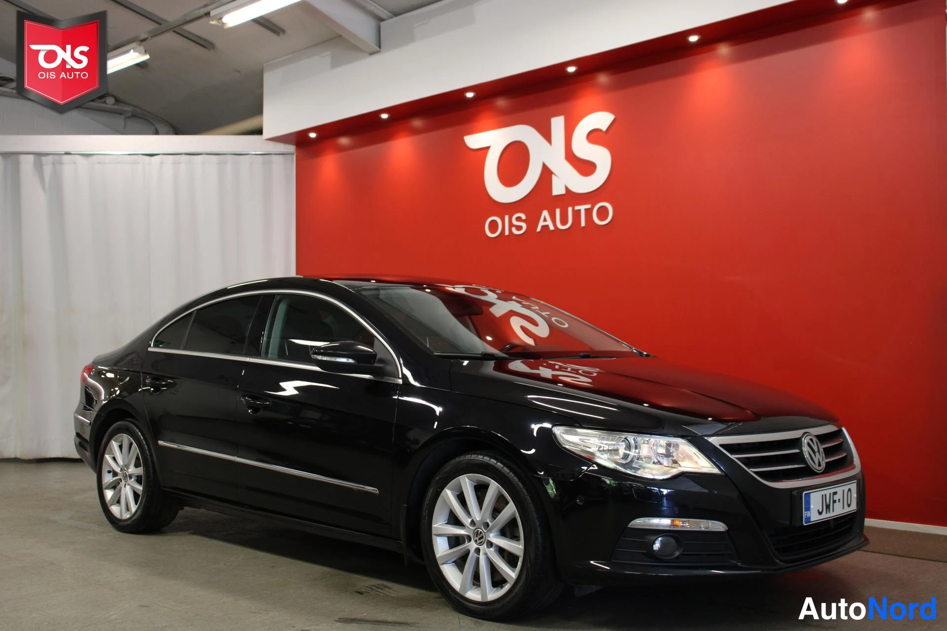 Musta Volkswagen Passat 2009, etuviisto, keula oikealle, kuva 4