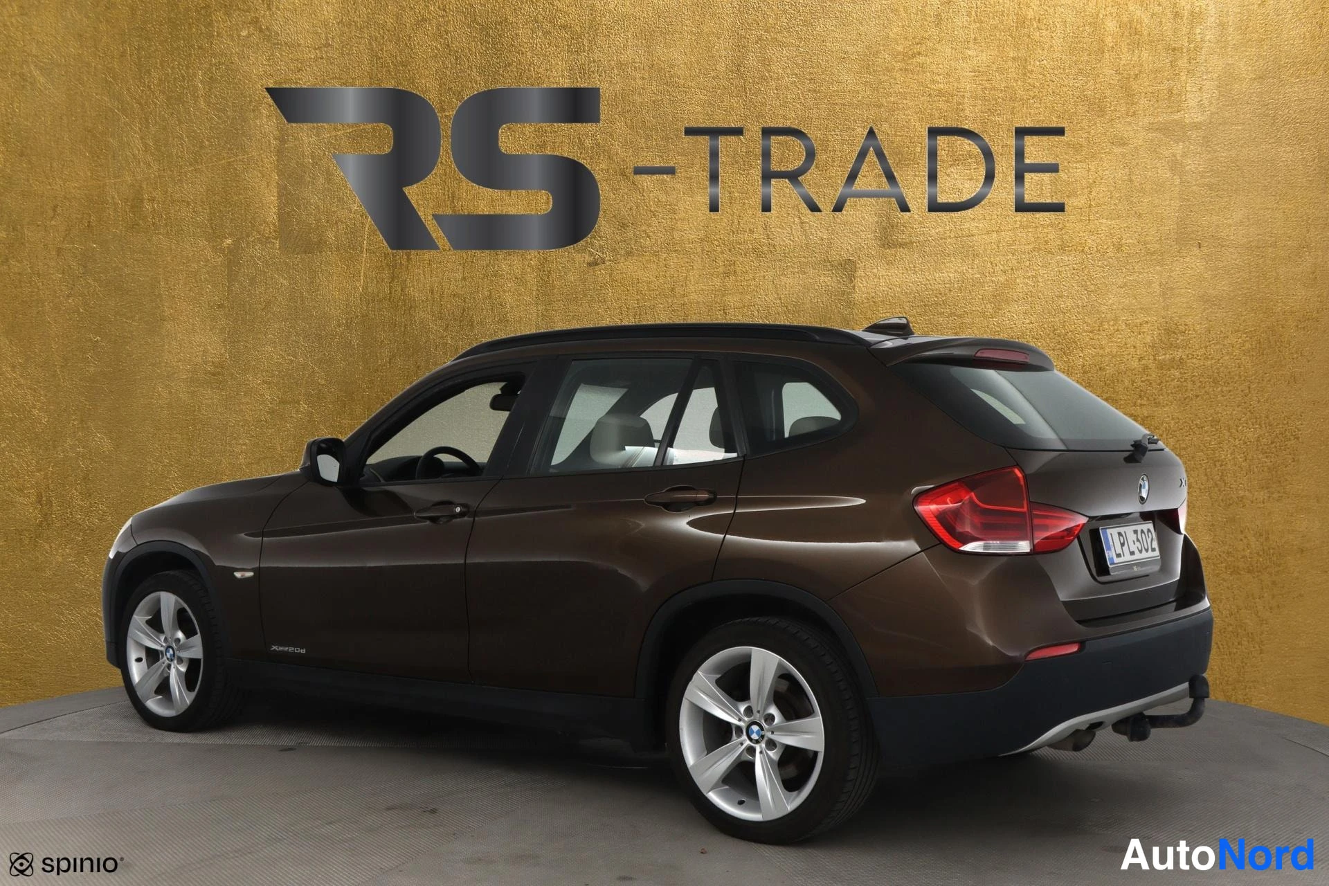 Ruskea BMW X1 2009, takaviisto, kuva 6