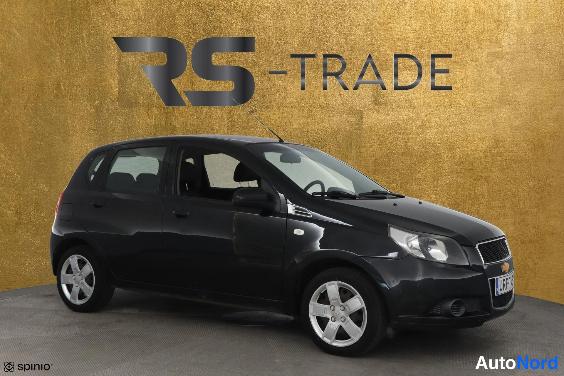 Black Chevrolet Aveo 2012, front three-quarter, nose to the right, photo 3