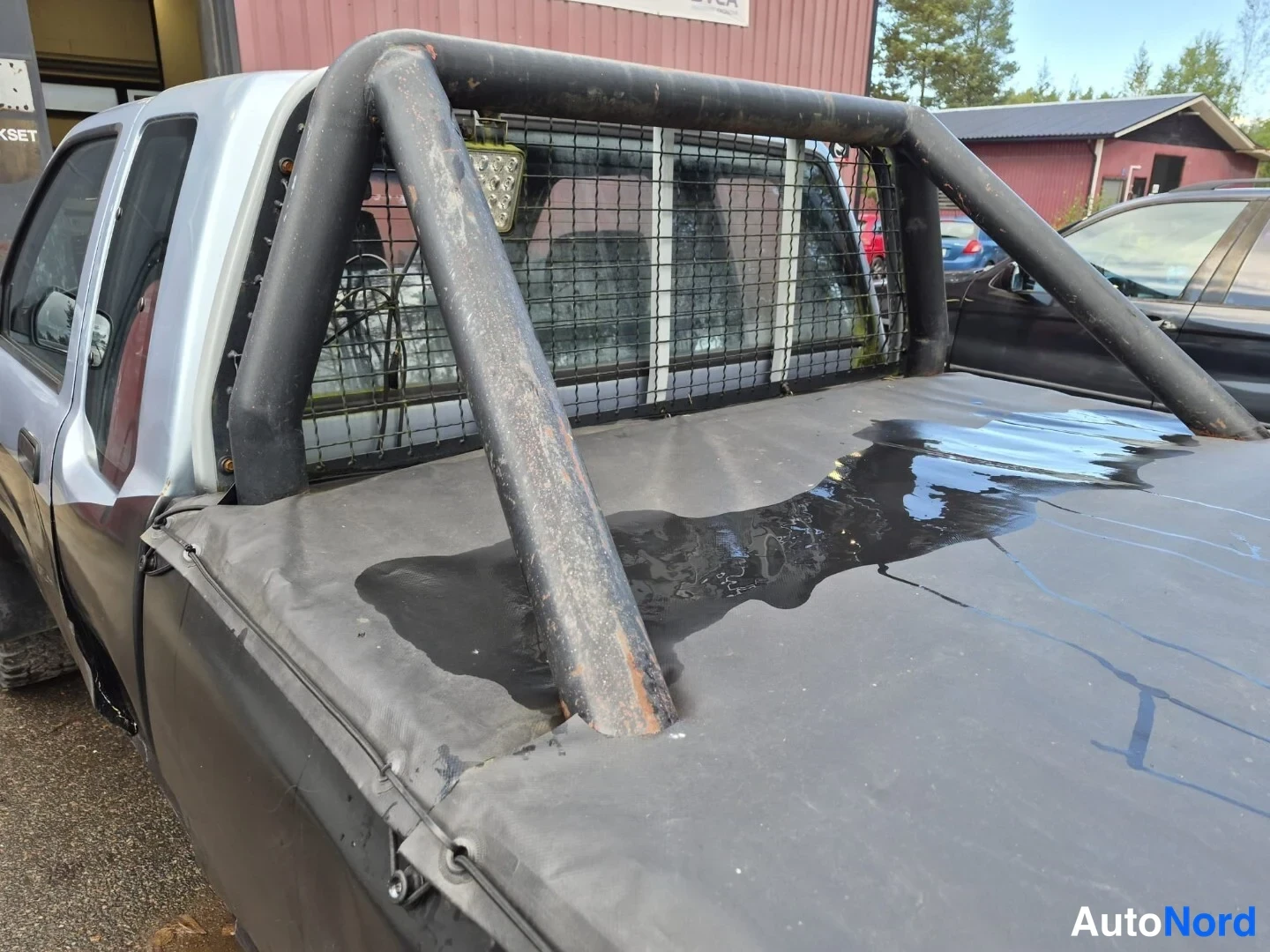 Sininen Toyota Hilux 1990, sivulta, kuva 11