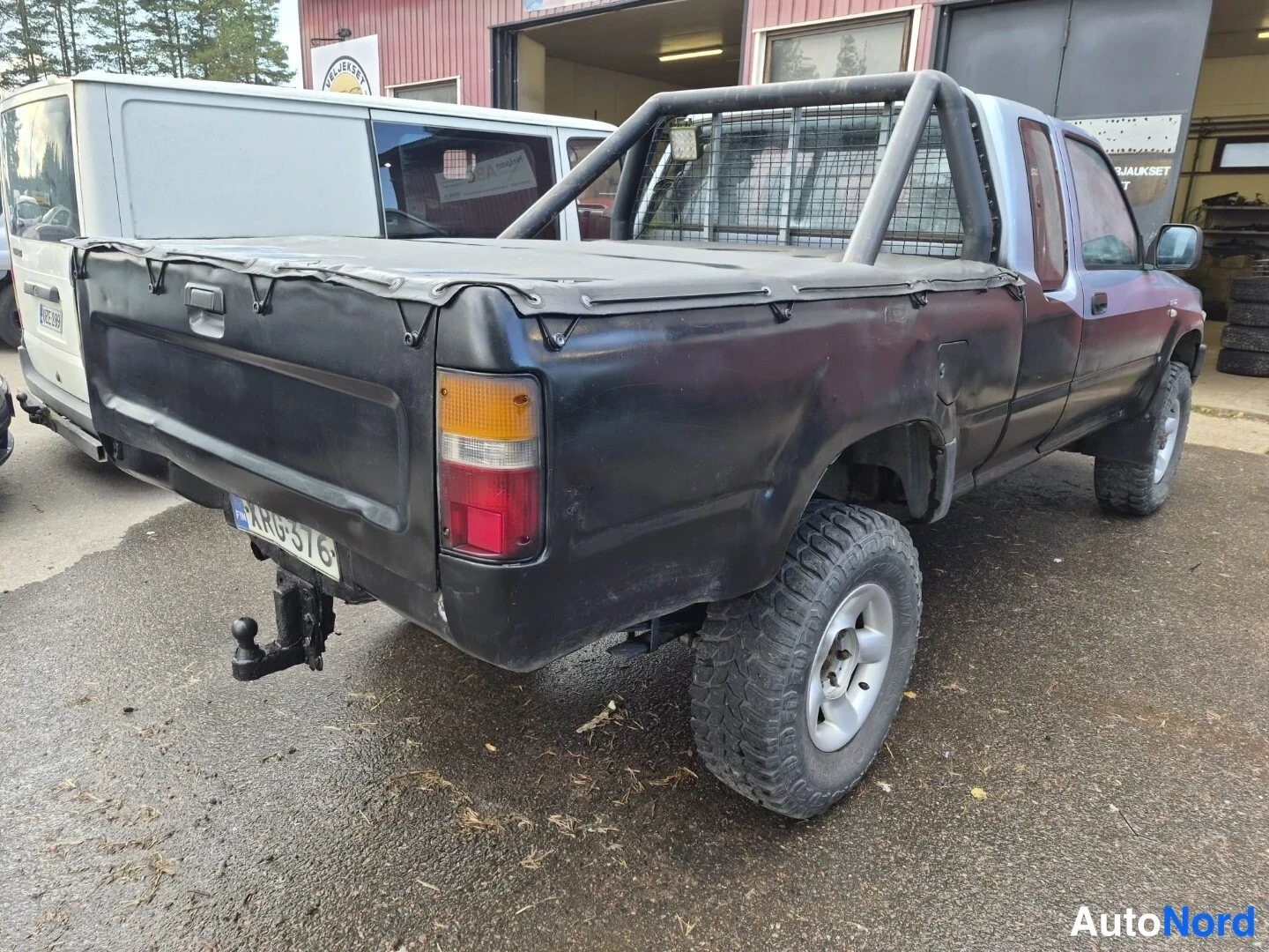 Sininen Toyota Hilux 1990, takaviisto, kuva 12