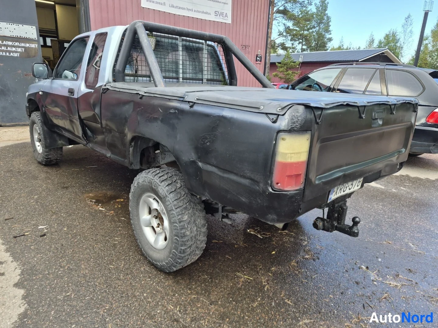 Sininen Toyota Hilux 1990, takaviisto, kuva 13