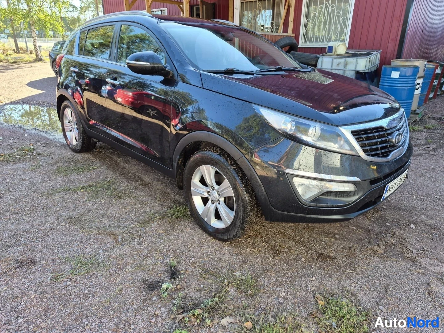 Musta Kia Sportage 2012, etuviisto, keula oikealle, kuva 3