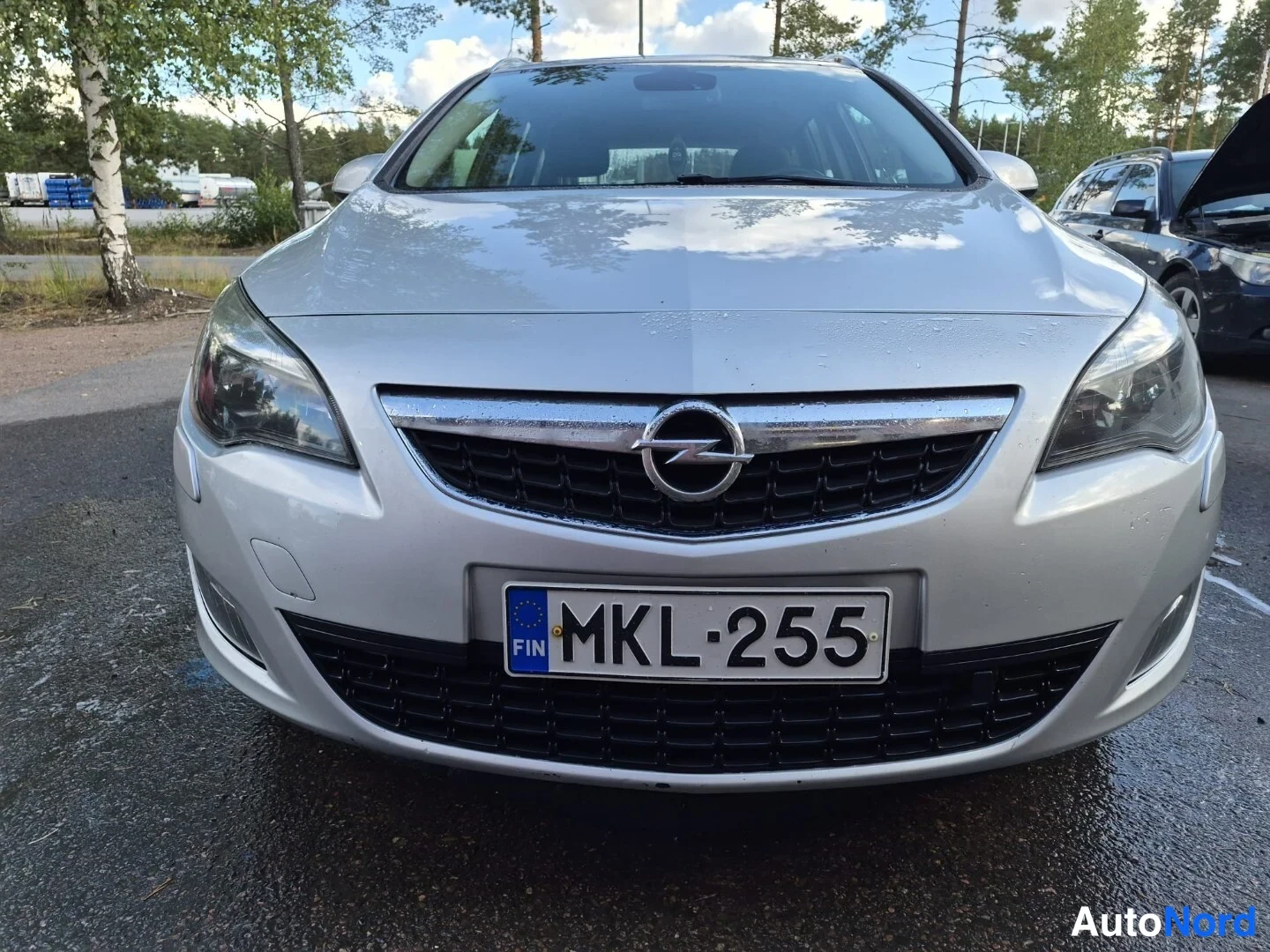 Harmaa Opel Astra SPORTS TOURER 2011, edestä, kuva 4