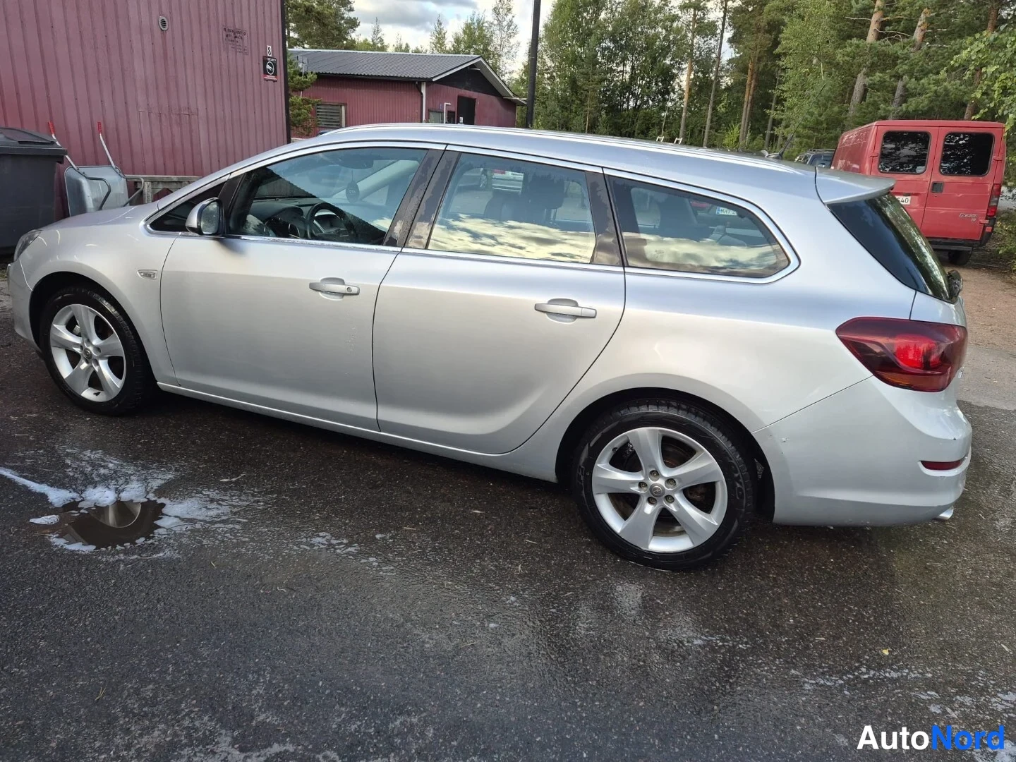 Harmaa Opel Astra SPORTS TOURER 2011, sivulta, kuva 6