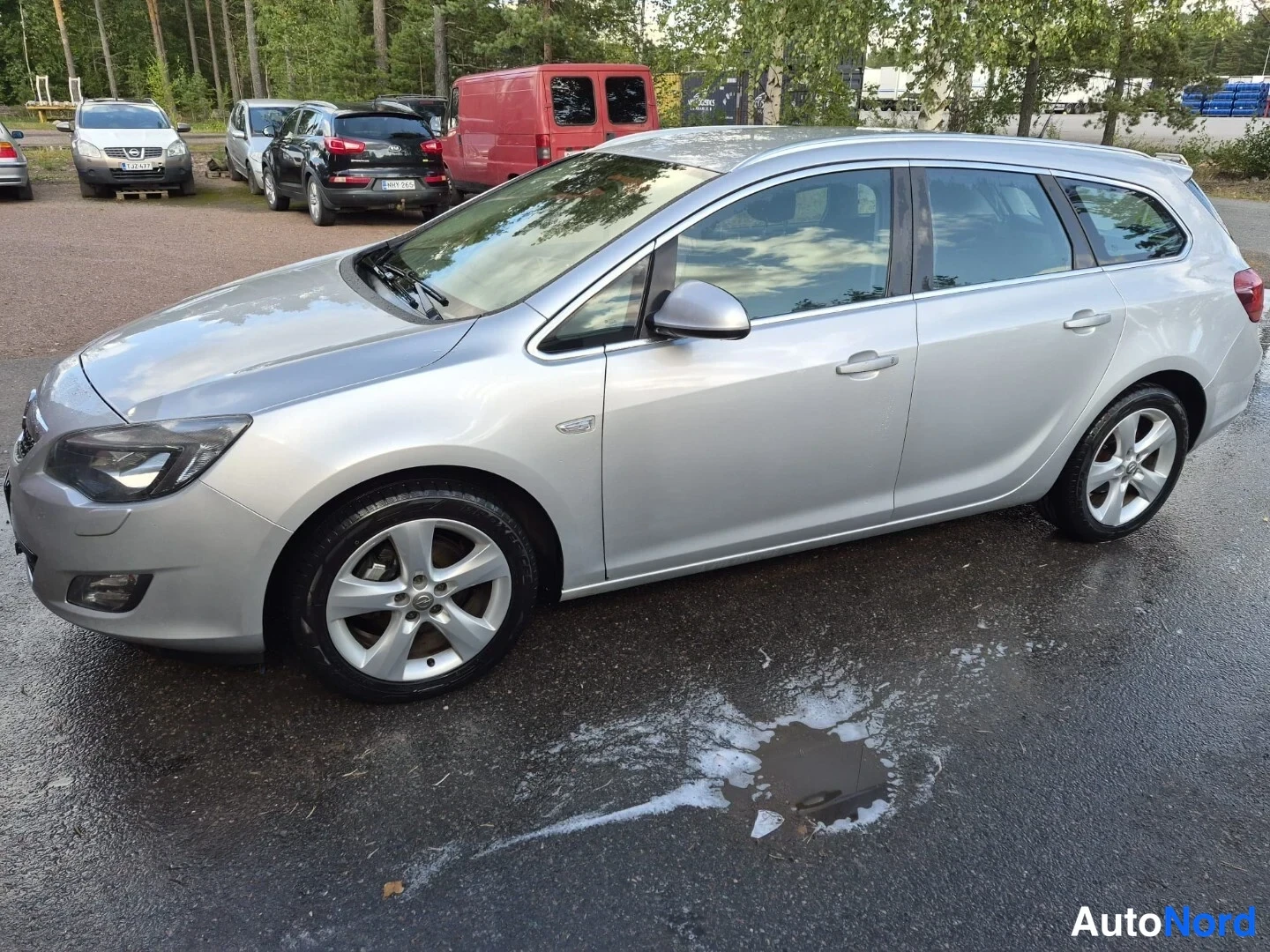 Harmaa Opel Astra SPORTS TOURER 2011, etuviisto, keula vasemmalle, kuva 2