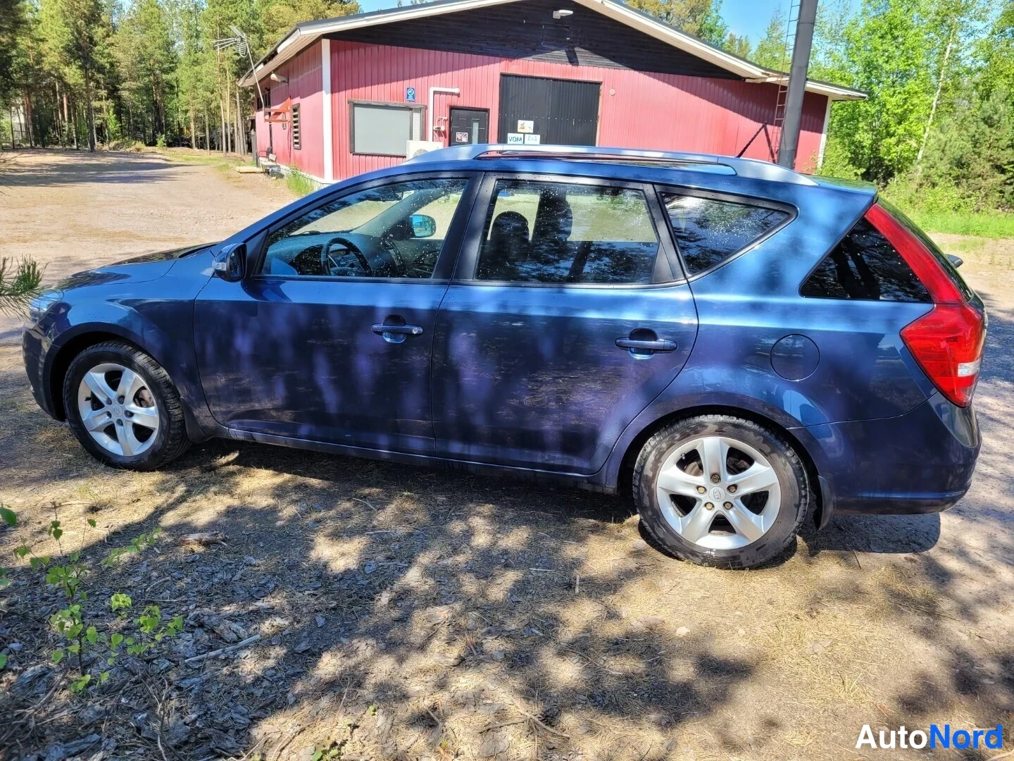 Sininen Kia Ceed 2011, sivulta, kuva 6