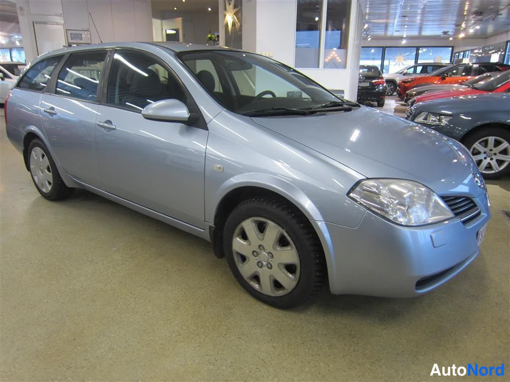 Sininen Nissan Primera 2006, etuviisto, keula oikealle, kuva 2