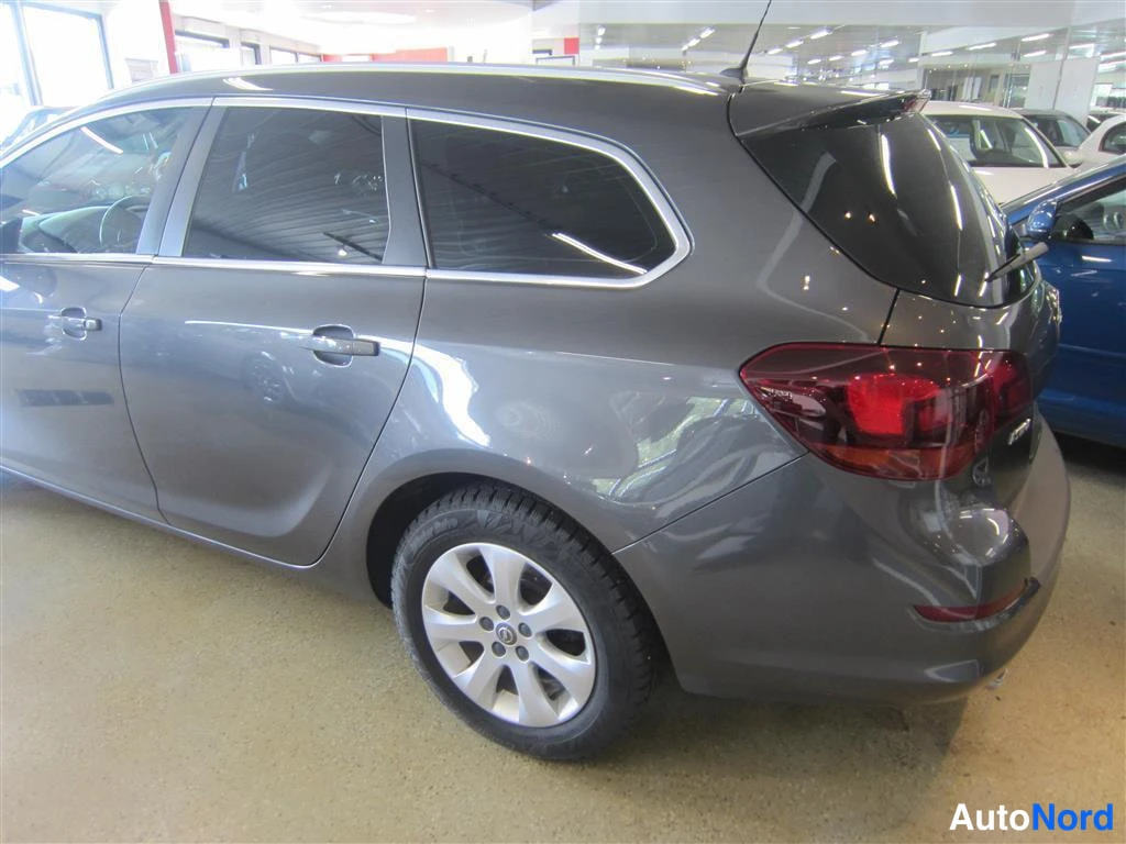 Harmaa Opel Astra 2012, takaviisto, kuva 6