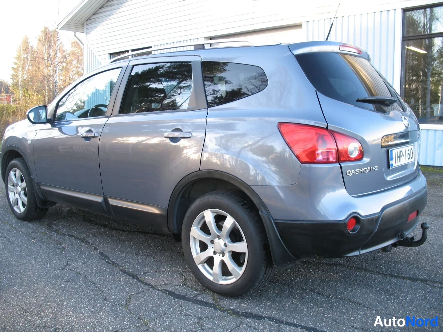 Turkoosi Nissan Qashqai+2 2009, takaviisto, kuva 11