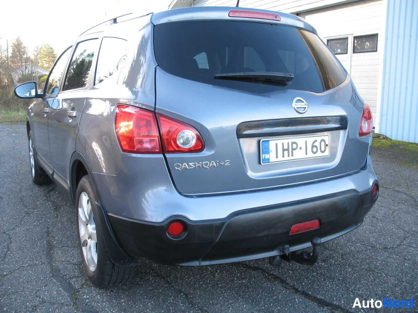 Turkoosi Nissan Qashqai+2 2009, takaviisto, kuva 13