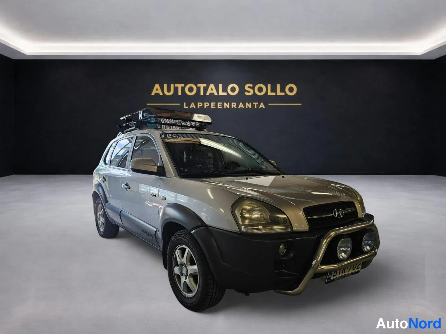 Harmaa Hyundai Tucson 2006, etuviisto, keula oikealle, kuva 2