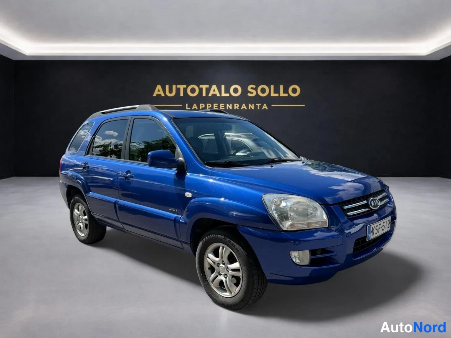Sininen Kia Sportage 2006, etuviisto, keula oikealle, kuva 2