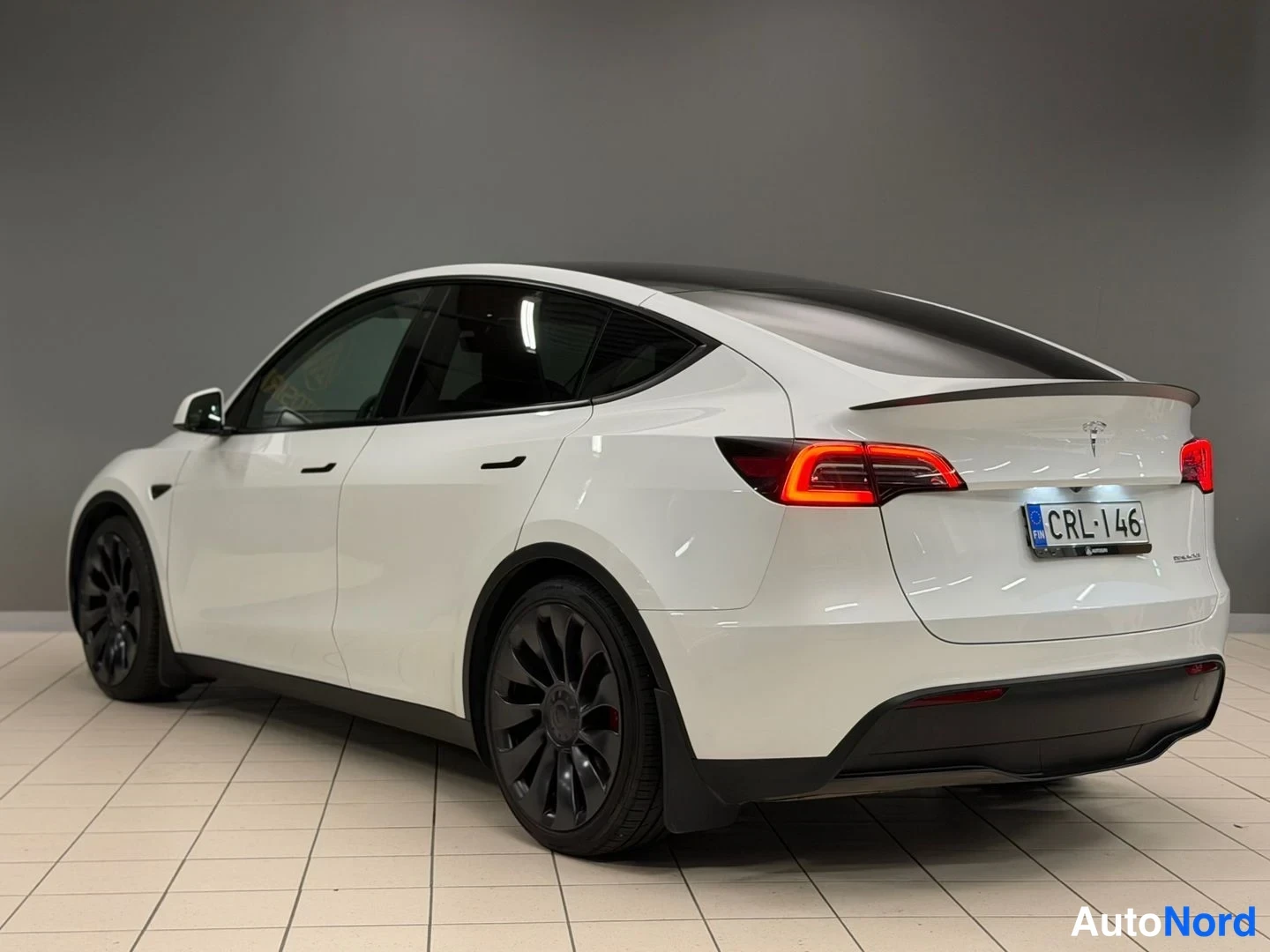 White Tesla Model Y Performance 2023, rear three-quarter, photo 7