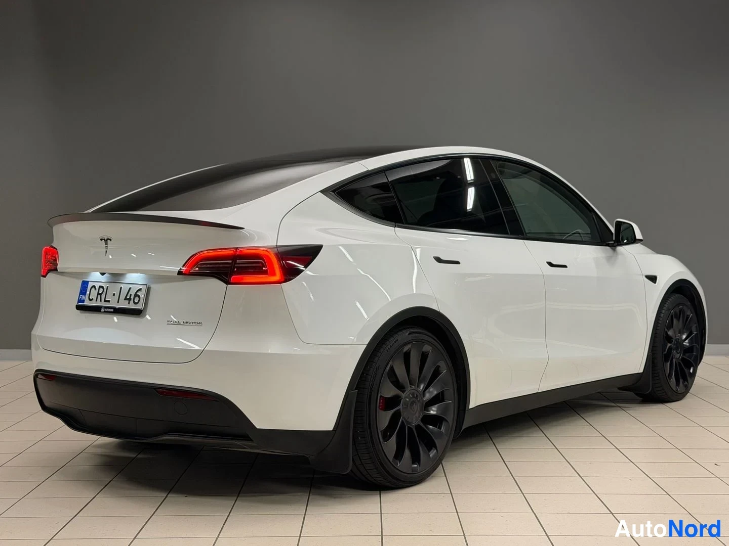 White Tesla Model Y Performance 2023, rear three-quarter, photo 8