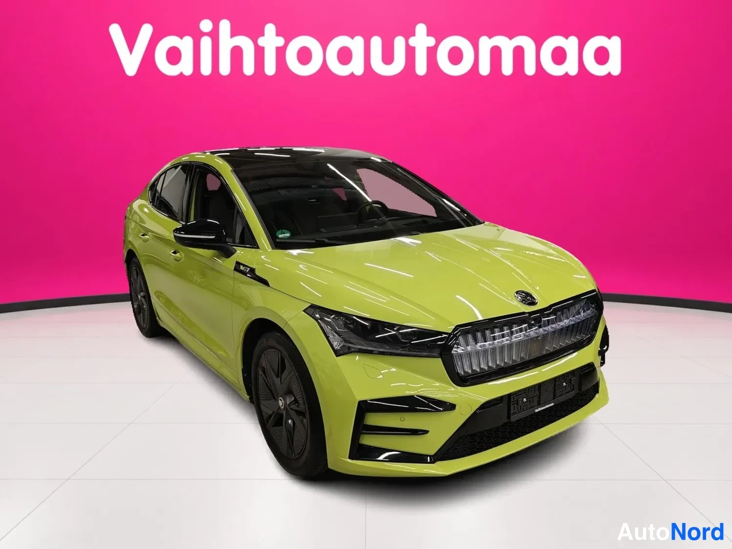 Green Skoda Enyaq Coupe 2023, front three-quarter, nose to the right, photo 2