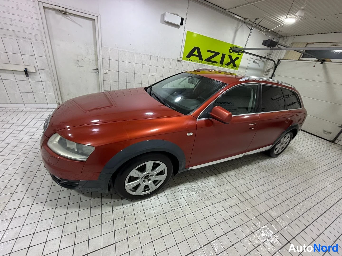 Red Audi A6 allroad quattro 2008, front three-quarter, nose to the left, photo 2