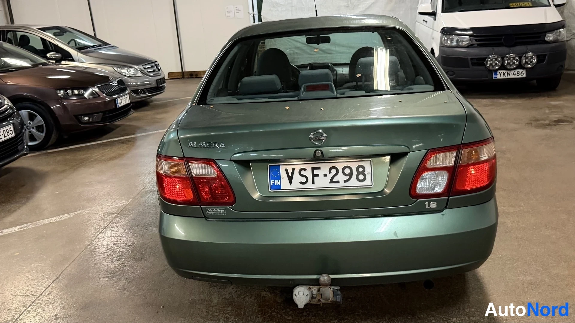 Vihreä Nissan Almera 2003, takaa, kuva 9