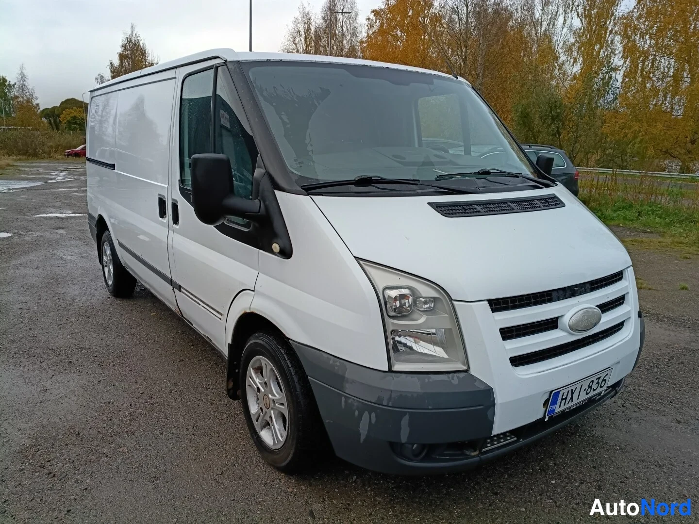 White Ford Transit 2009, front three-quarter, nose to the right, photo 2