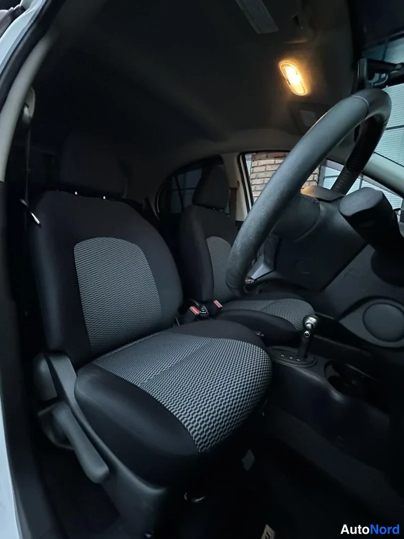 White Nissan Micra 2015, front seats, photo 18