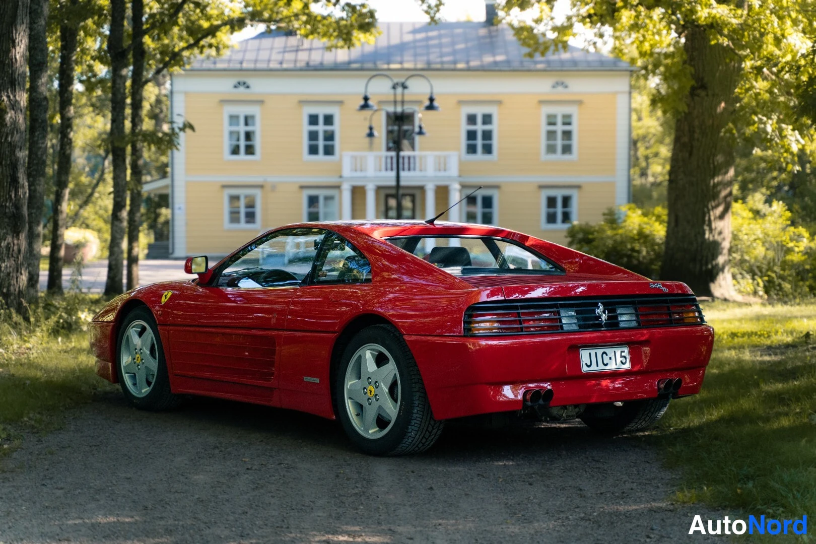 Red Ferrari 348 1991, rear three-quarter, photo 5