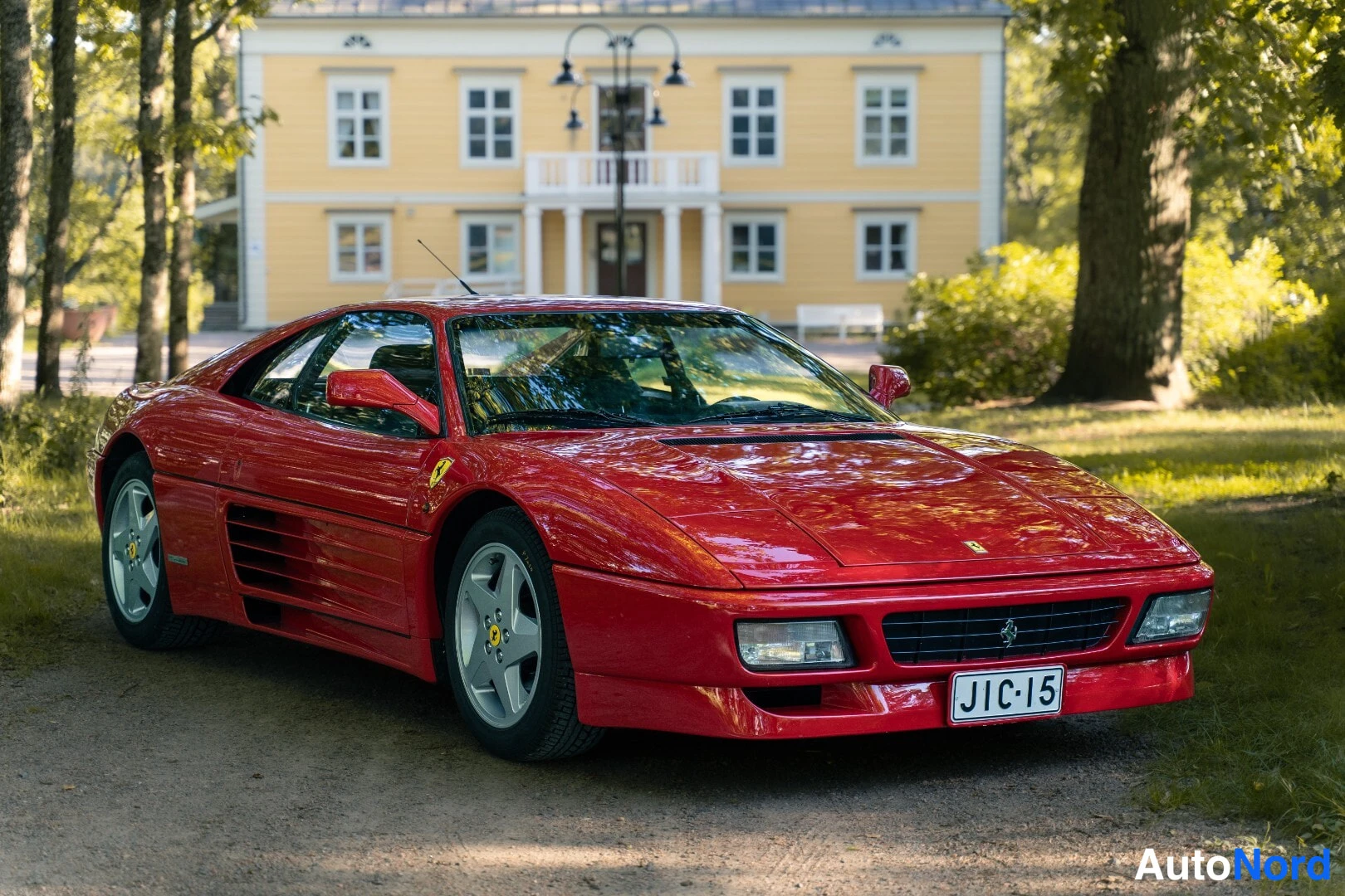 Red Ferrari 348 1991, front three-quarter, nose to the right, photo 3