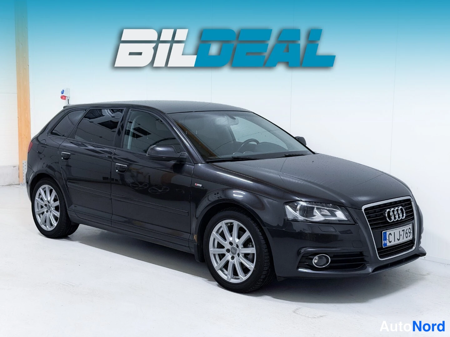 Black Audi A3 2011, front three-quarter, nose to the right, photo 2