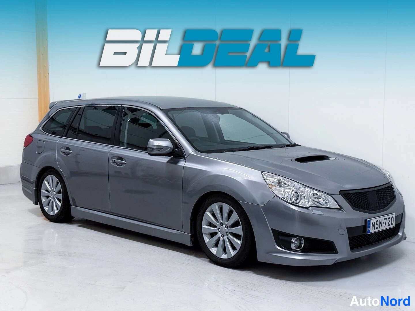 Silver Subaru Legacy 2009, front three-quarter, nose to the right, photo 2