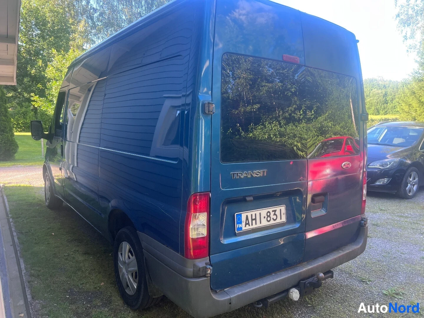 Blue Ford Transit 2007, rear three-quarter, photo 4