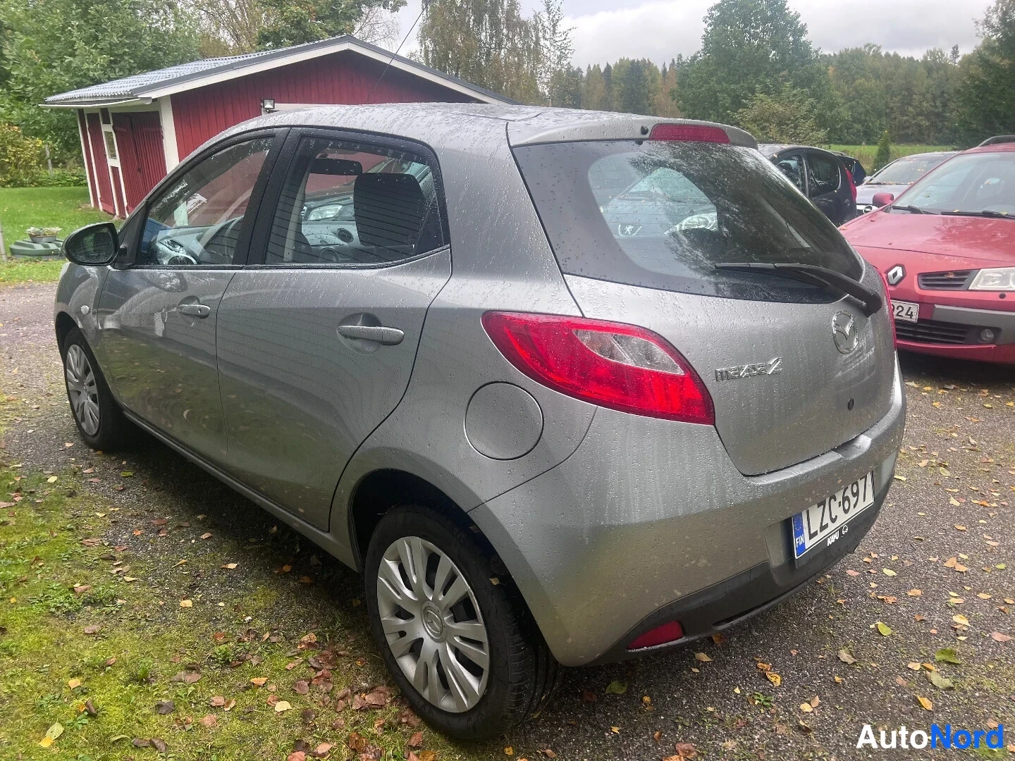 Grey Mazda 2 2010, rear three-quarter, photo 4