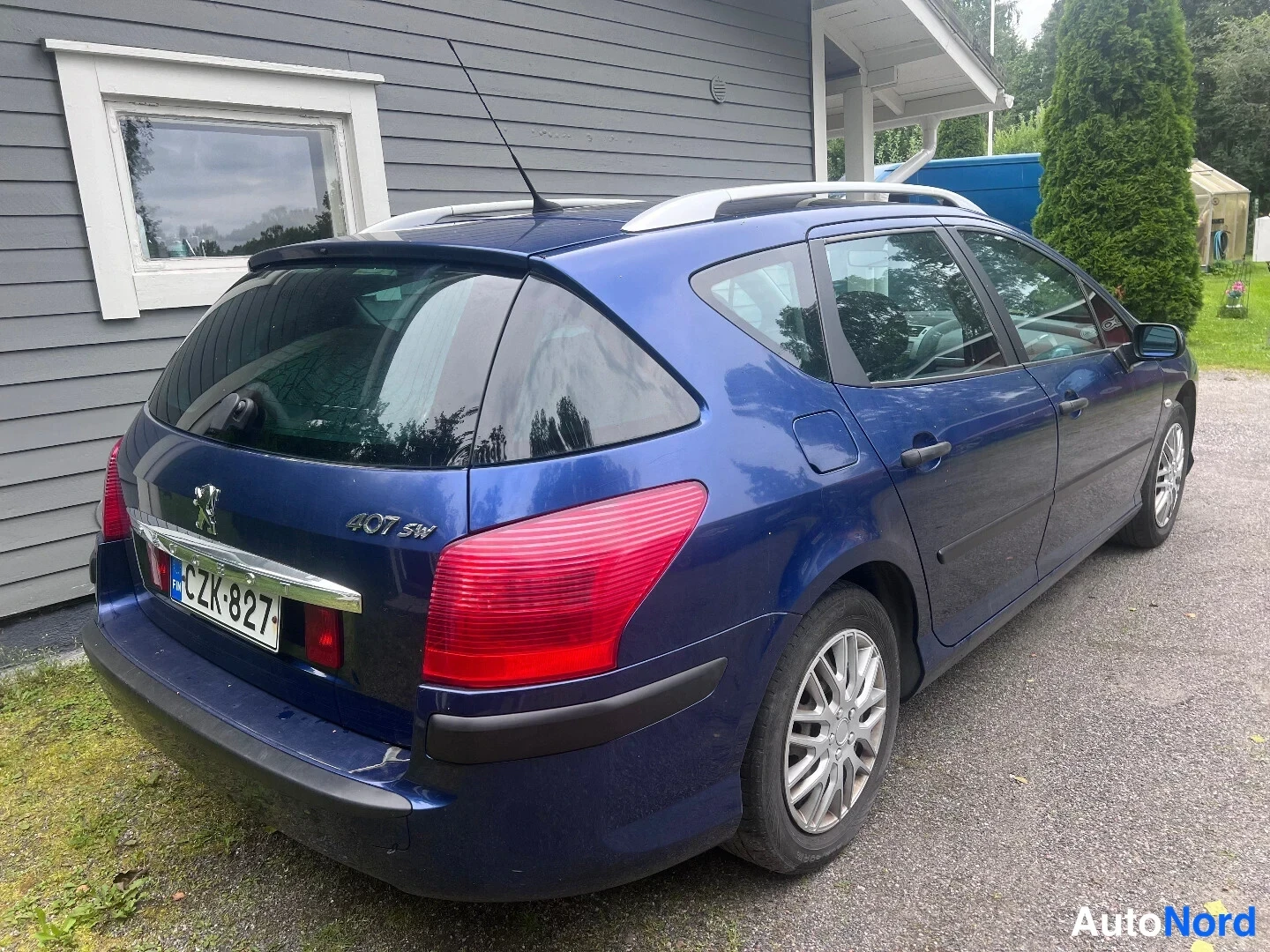 Blue Peugeot 407 2006, rear three-quarter, photo 3