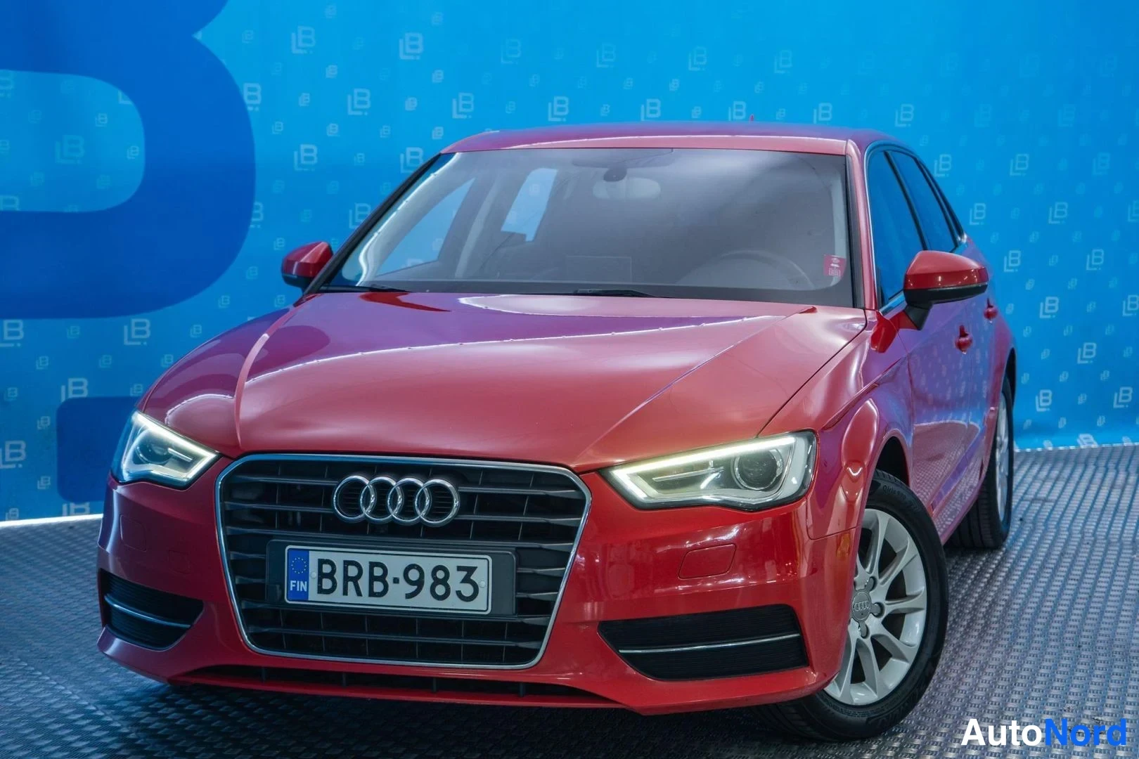 Red Audi A3 2013, front three-quarter, nose to the left, photo 2