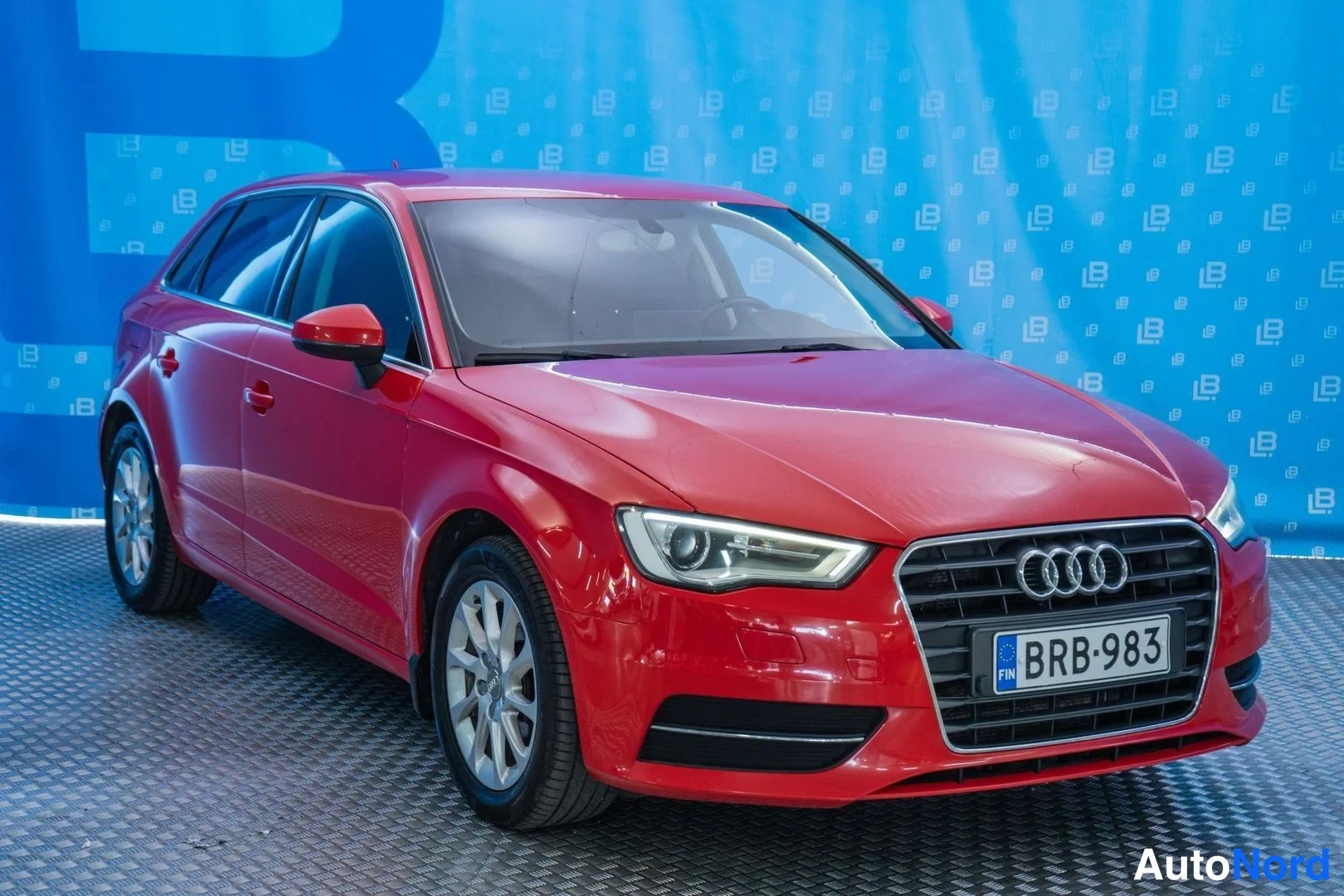 Red Audi A3 2013, front three-quarter, nose to the right, photo 3