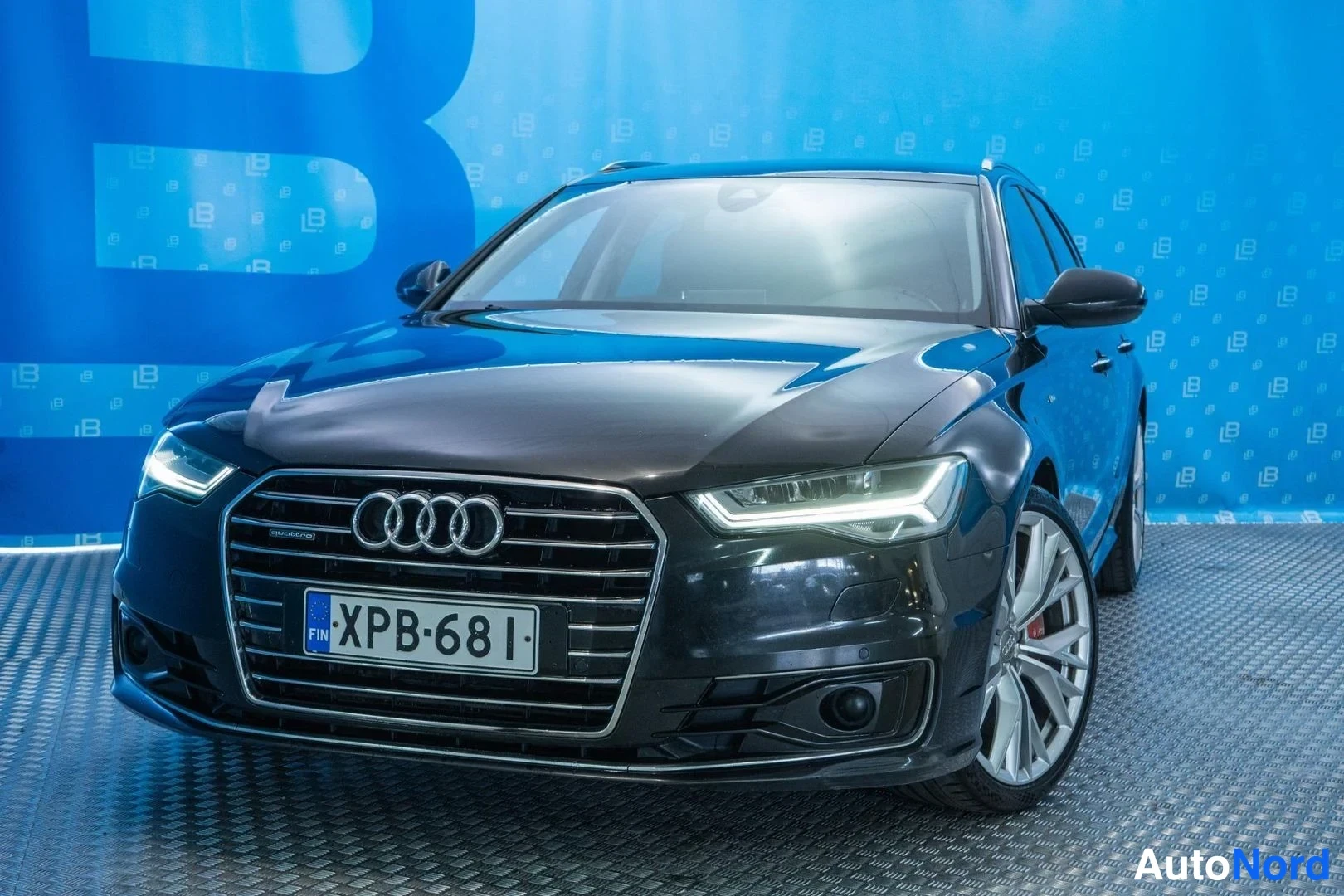 Black Audi A6 2015, front three-quarter, nose to the left, photo 2