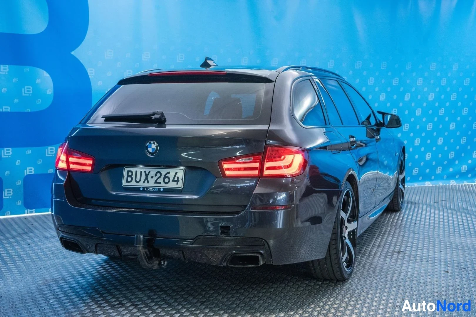 Grey BMW M550d xDrive 2012, rear three-quarter, photo 5